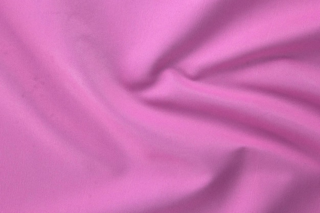 A textura de close-up de tecido beige natural rosa e tecido de cor rosa textura de tecido de algodão natural ou papel de parede têxtil de linho