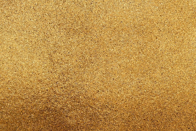 A textura de pequenas lascas de ouro ou glitter