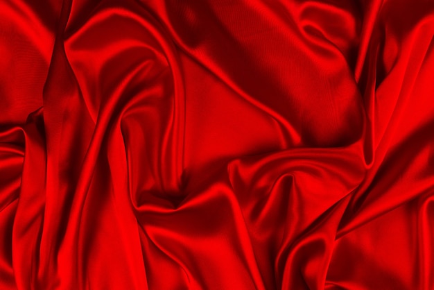A textura de tecido de seda vermelha ou cetim luxuoso pode ser usada como fundo abstrato. Vista do topo