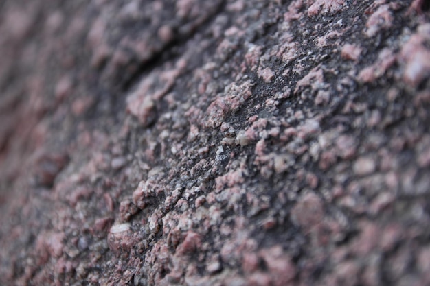 A textura do granito em estilo retrô A textura do granito closeup Fundo de pedra decorativa de granito