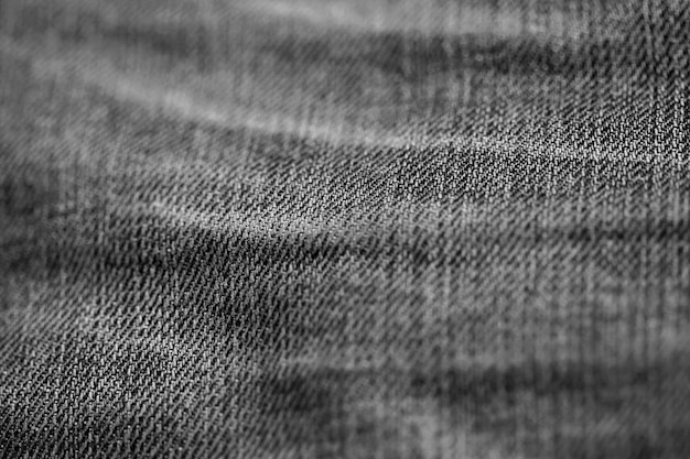 A textura do jeans denim fecha o foco apenas um ponto de papel de parede de fundo desfocado macio