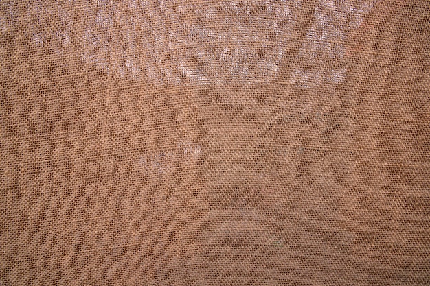 A textura do padrão de pano de saco de linho de juta marrom pode ser usada como papel de parede de fundo