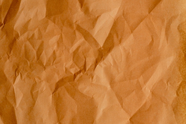 Foto a textura do papel amassado é laranja. vista do topo