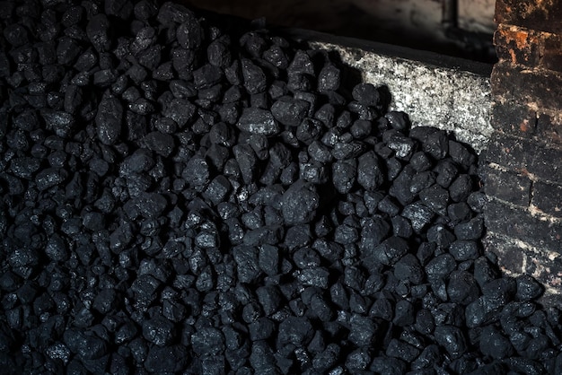 Foto a textura e o fundo do carvão um combustível fóssil para aquecimento industrial e doméstico