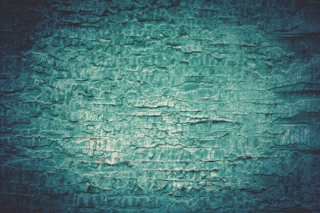 Abblätternde Farbe auf einer alten Holzwand. Grunge-Hintergrund