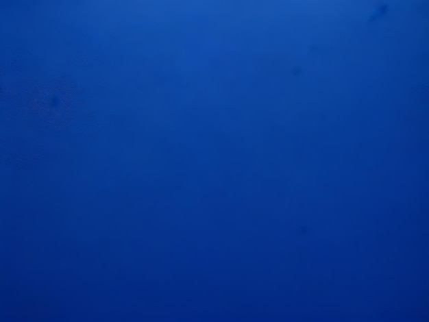Abstracto grunge relieve decorativo estucado azul marino textura de pared de ángulo amplio fondo de color áspero