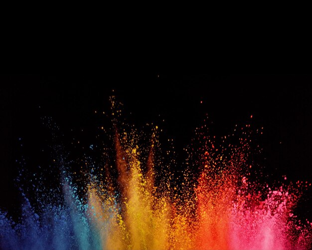 Foto abstracto de polvo salpicado de fondo explosión de polvo de colores sobre fondo negro de color