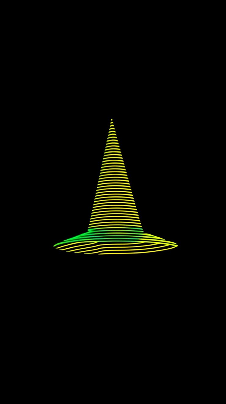 Foto abstracto sombrero verde y amarillo sobre fondo negro