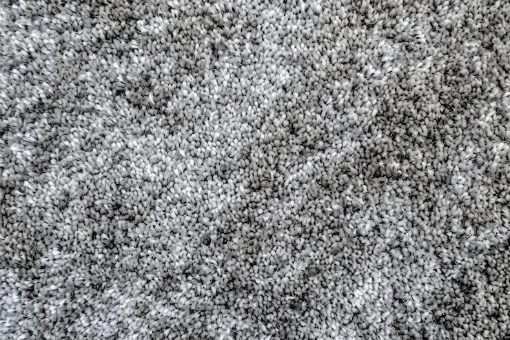 Foto abstracto textura de tapete cinza fundo com fibra curta para decoração de tapete sem costura