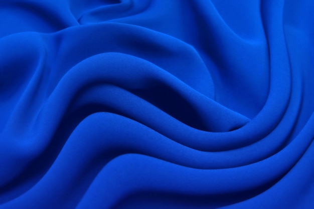 Abstrakte blaue Farbe Seide Chiffon Stoff Textur Hintergrund.