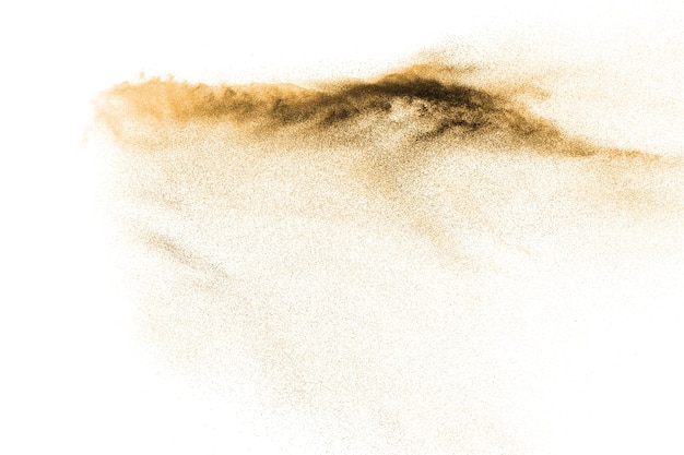 Abstrakte Sandwolke. Goldsandspritzen gegen auf klaren Hintergrund.