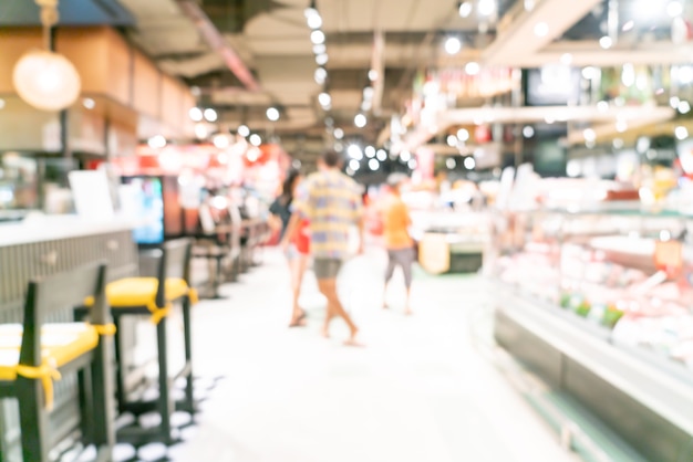 abstrakte Unschärfe und defokussierter Supermarkt für