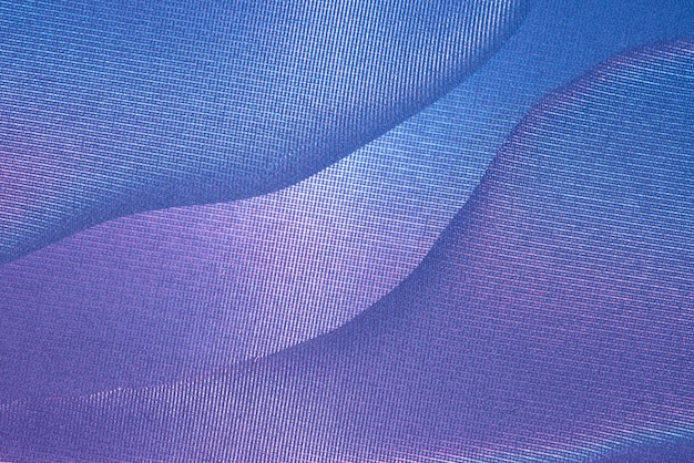 Abstrakter blauer und magentafarbener Fotografiehintergrund mit Kurven und Beschaffenheit.