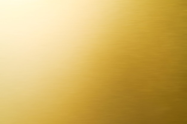 Abstrakter glänzender Goldbeschaffenheitshintergrund.