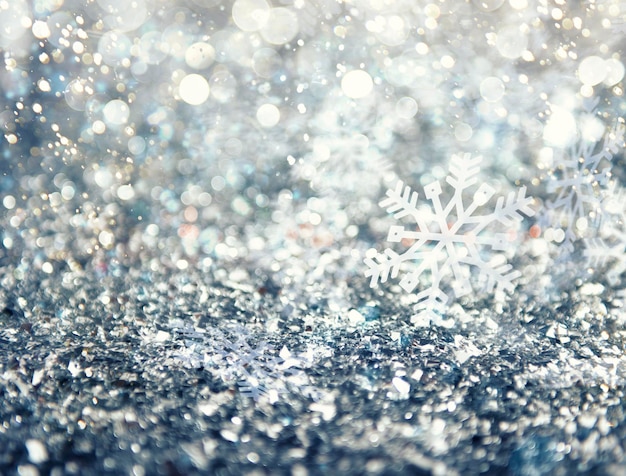 Foto abstrakter glühender weihnachtlicher blauer hintergrund mit schneeflocken