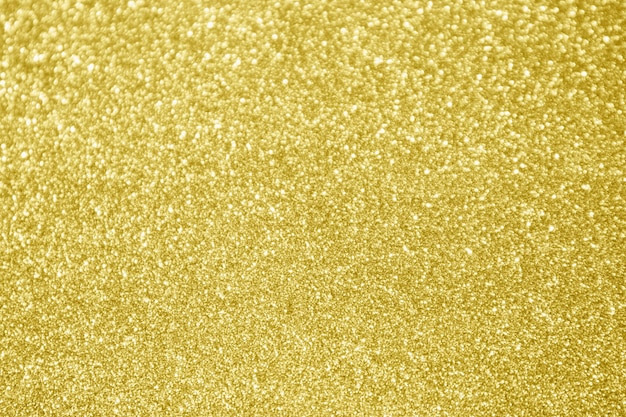 Abstrakter Goldglitter funkeln Bokehhellhintergrund