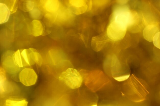 Abstrakter Hintergrund der goldenen bokeh undeutlichen Unschärfe.
