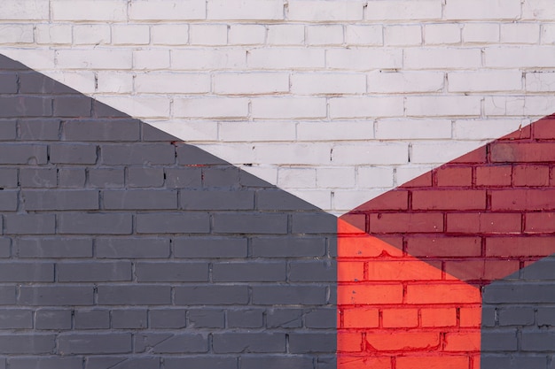Abstrakter Hintergrund der mehrfarbigen Backsteinmauer. Außendesign,