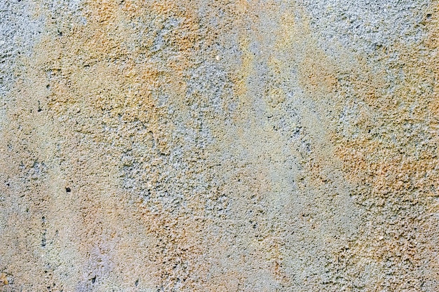 Abstrakter Hintergrund von der Oberfläche einer grauen rauen Betonwand