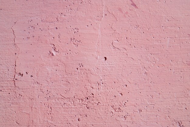 Abstrakter rosa Hintergrund. Alte Wandbeschaffenheit. Stuck raue Oberfläche.