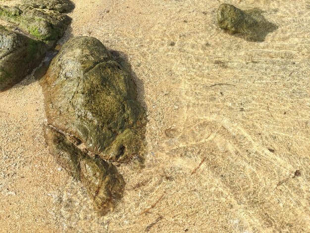 Abstrakter Sand des Strandes und des weichen Wellenhintergrundes