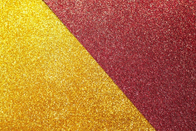 Abstraktes Gold und roter Glitzerhintergrund funkeln Textur