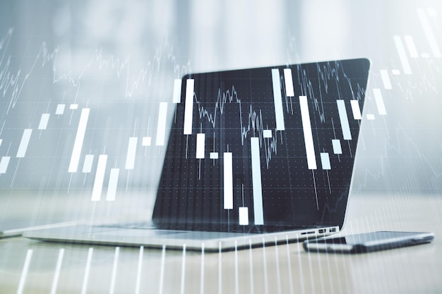 Abstraktes kreatives Finanzdiagramm auf modernem Laptop-Hintergrund Finanz- und Handelskonzept Mehrfachbelichtung
