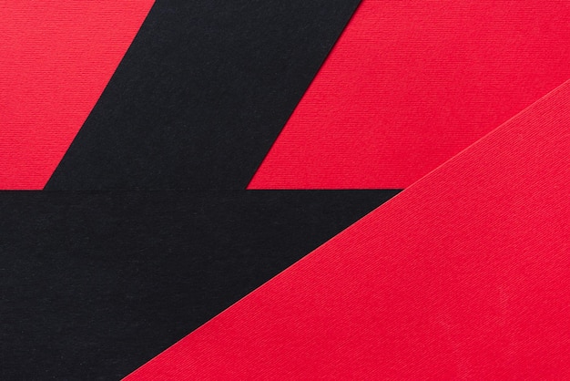 Abstraktes Papier geometrischer schwarzer roter Hintergrund Kopieren Sie Platz für Ihren Text Ansicht von oben