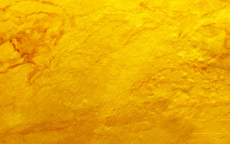 Foto abstrato de textura de aço de metal polido ouro.