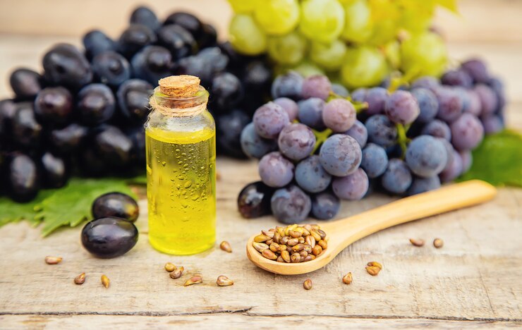 Foto aceite de semilla de uva en una botella pequeña