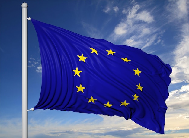 Acenando a bandeira da UE no mastro da bandeira no fundo do céu azul