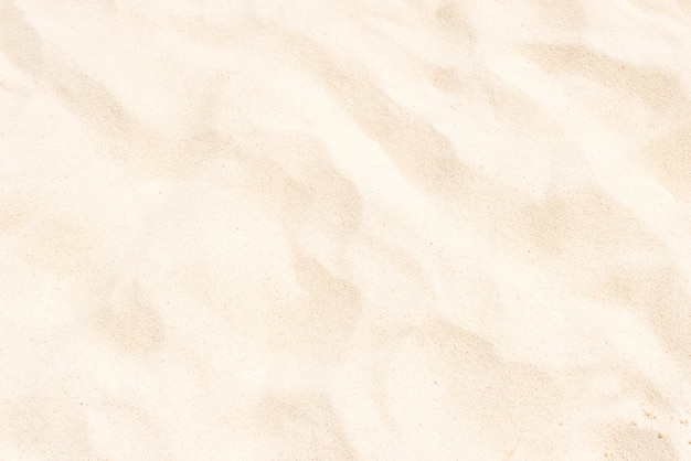 Acercamiento de la textura de arena fina blanca. Se puede utilizar como fondo de vacaciones de verano