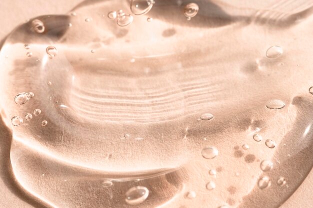 Foto Ácido hialurónico peptídico líquido en gel de aloe vera sobre un fondo beige macro de textura cosmética