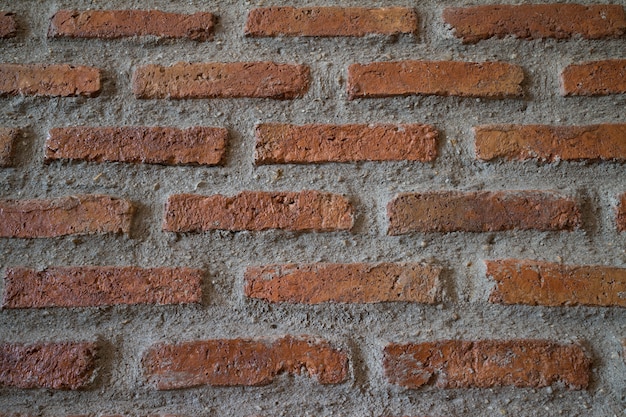 Acient Ziegelmauer. Grunge Backsteinmauerhintergrund. Hintergrund der alten Weinlesebacksteinmauer