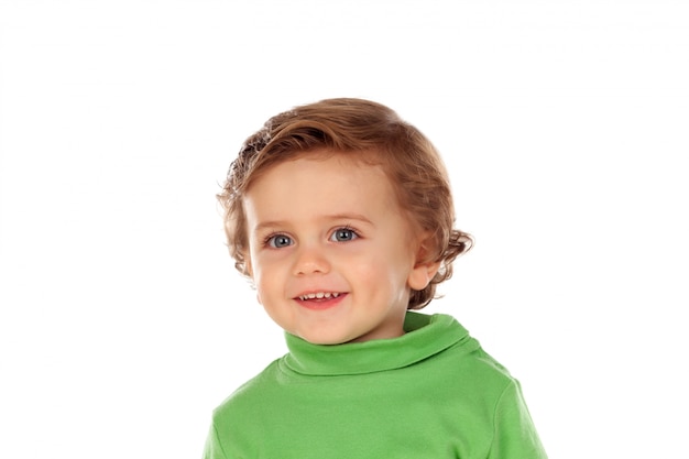 Adorable bebé con camisa verde