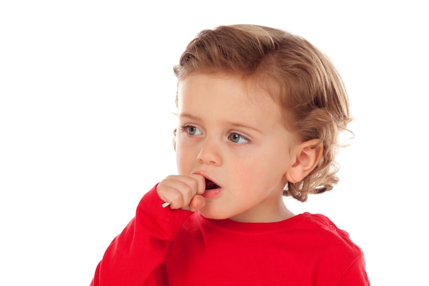 Adorable bebé comiendo una piruleta