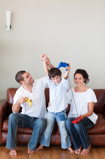 Affecionate family playing video games