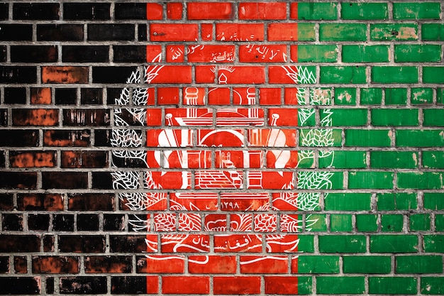 Afghanistan-Flagge auf einem Grunge-Backstein-Hintergrund