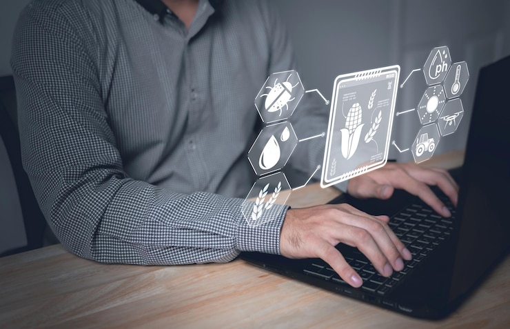 Foto agricultor trabaja en una pantalla de computadora virtualhombre que usa una computadora portátil para examinar o analizar el cultivo de maíz joven después de plantar tecnología para la agriculturaconceptoconcepto de internet de las cosas