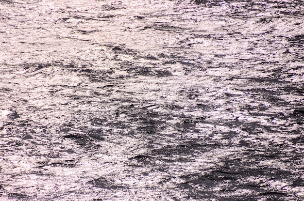 Foto Água do mar azul ainda com ondinha. textura de foto de fundo natural