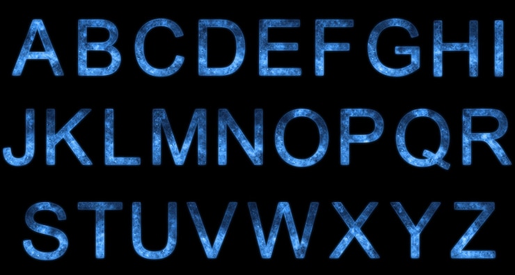 Foto alfabeto estrellado estilizado. letras espaciales. alfabeto espacial. azul sobre fondo negro
