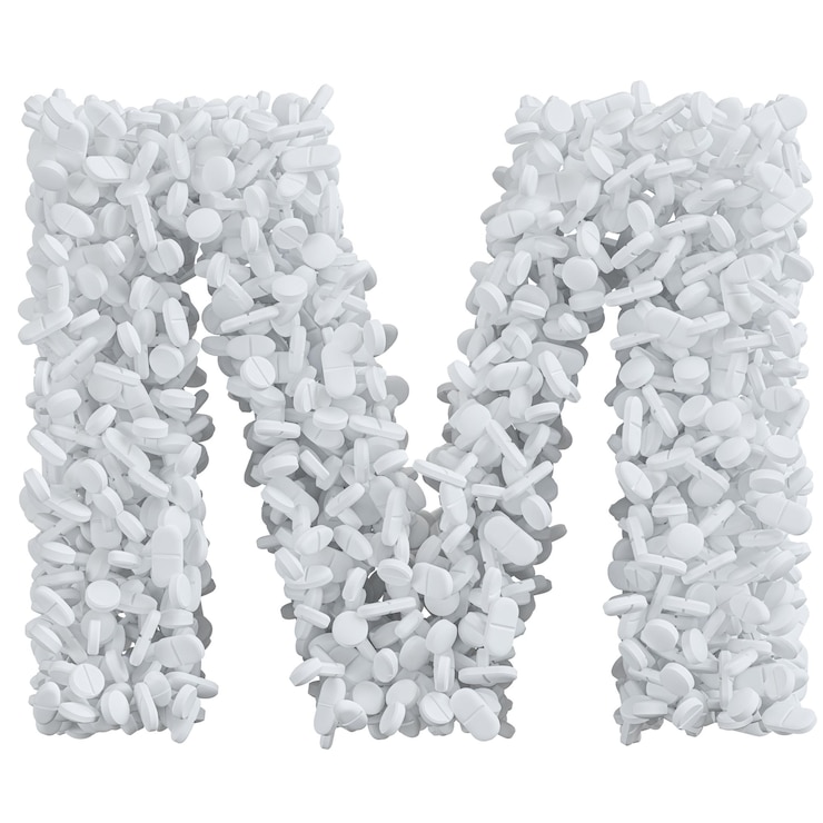 Foto alfabeto hecho de pastillas blancas letra m