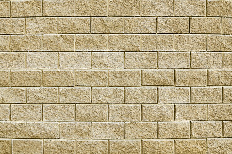 Alte beige Steinmauer Hintergrundbeschaffenheit