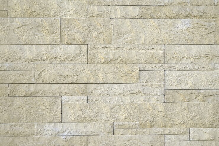 Alte beige Steinwandbeschaffenheit
