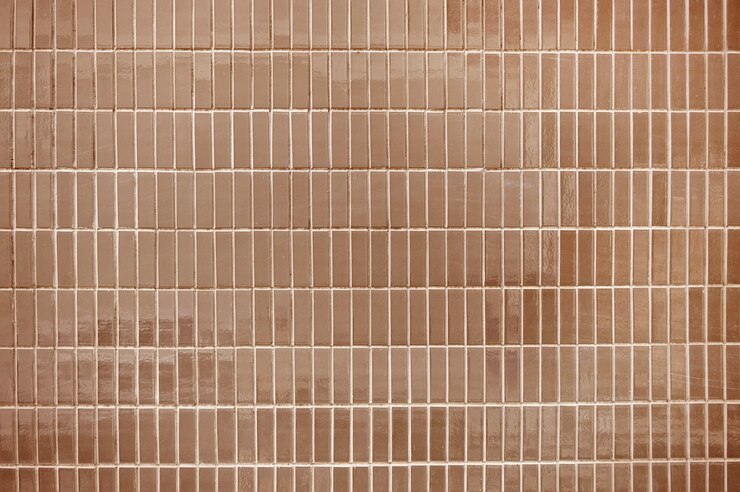 Alte braune Fliesenwand-Hintergrundbeschaffenheit