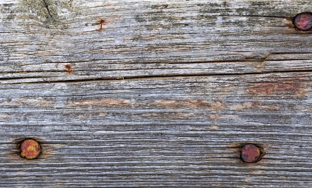 Alte Holzstruktur mit rostigen Nägeln, Nahaufnahme, hochdetailliertes Hintergrundfoto