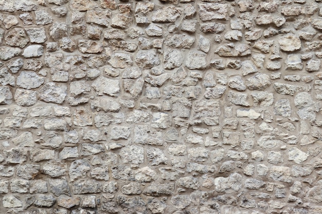 Alte Mauer mit Steinen und Zement