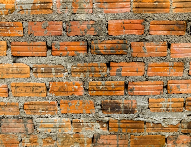 Alte orange Backsteinmauer Textur und Hintergrund