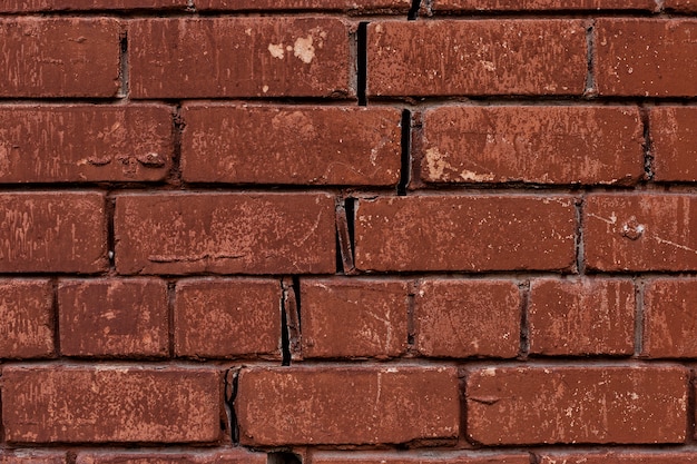 Alte rote Backsteinmauer, rustikale, zerbrochene Beschaffenheit