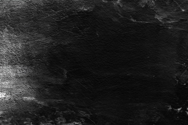 Foto alte schwarze stuckwand mit weißen kratzern und schrammen, strukturierter grunge-hintergrund für designer